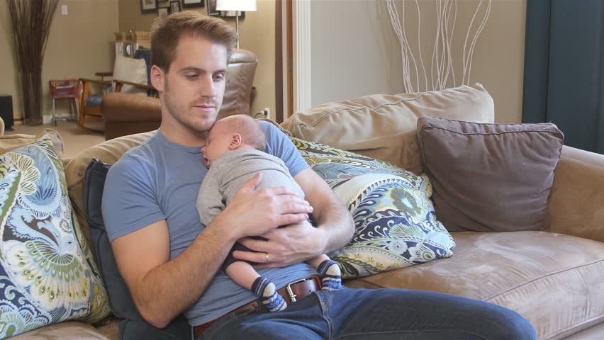 sleeping with baby on chest on couch