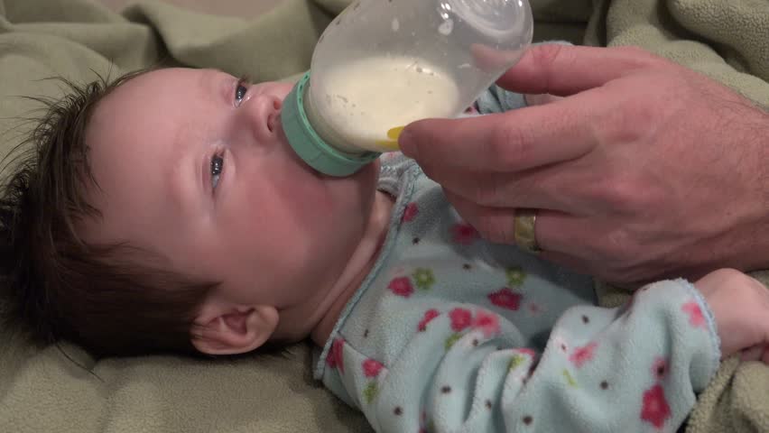 baby-falls-asleep-while-feeding-just-stock-footage-video-100-royalty