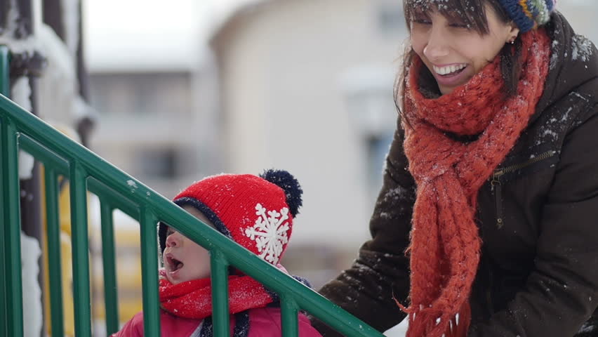 Happy family playing in winter scene
