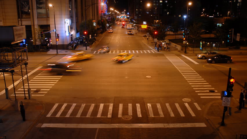 Overhead view of city intersection at night time lapse