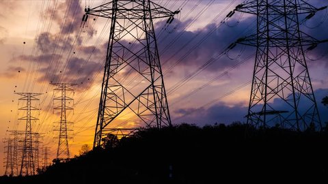 4K. Timelapse of Silhouette electricity pylons in sunset background  - ULTRA HD, 4096x2304.