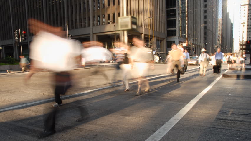 City commuters at crosswalk in rush hour