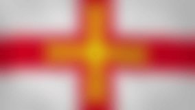 GG - internet domain of Guernsey. Typing top-level domain “.GG” against blurred waving national flag of Guernsey. Highly detailed fabric texture for 4K resolution. Clip ID: ax1061c