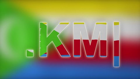 KM - internet domain of Comoros. Typing top-level domain “.KM” against blurred waving national flag of Comoros. Highly detailed fabric texture for 4K resolution. Source: CGI rendering. Clip ID: ax872c