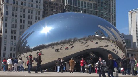 CHICAGO,USA - APRIL 17, 2013, Tourist people enjoy take photo with The Bean by day