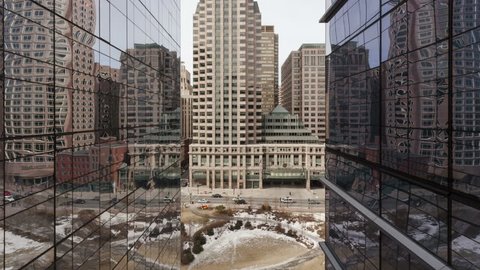 4K Time lapse traffic in mirror on Boston office building surface with reflections.