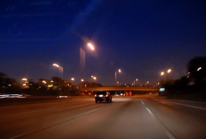 Driving on highway into city tunnel at night time lapse
