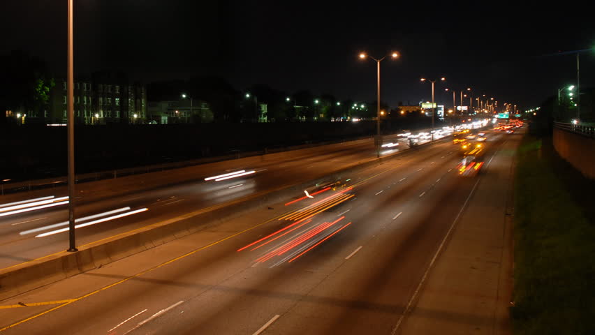 Speeding cars at night rush hour motion blur