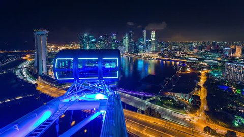 singapore - october 2014: night light singapore flyer famous view 4k time lapse, singapore.