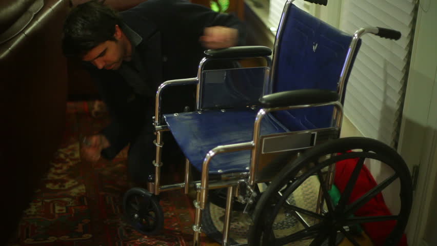 Repairing a wheel chair with a wrench