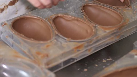 hands pastry chef working chocolate Easter eggs วิดีโอสต็อก