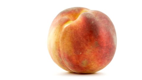 Ripe peach sliding across screen with white background in 4k