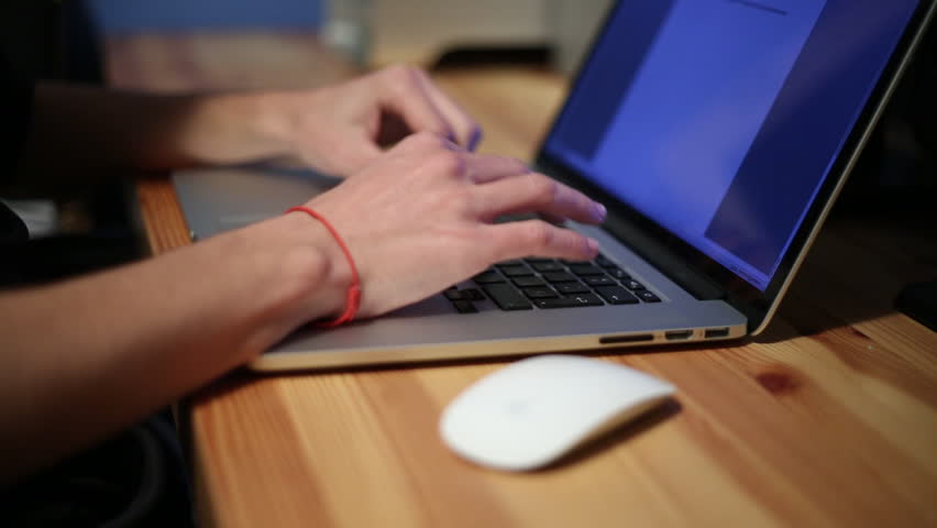 Businessman hands typing on a laptop keyboard, working with NoteBook in the desk office -Dan | Shutterstock HD Video #9025492