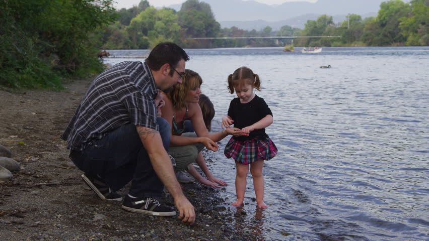 Family together by river