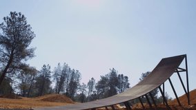 Motocross rider going off big jump, slow motion, 4K shot on RED Epic