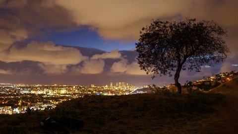 Scenic storm clouds passing over Los Angeles cityscape, view from Hollywood Hills towards Century City. Twilight to night transition, timelapse view.  Stockvideó