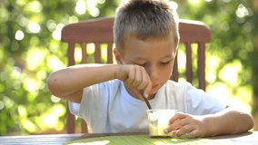 Little boy eating pudding outdoors; Nikon D3S, HD: Photo JPEG