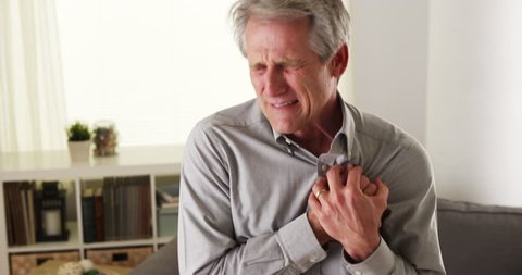 Mature man having heart attack