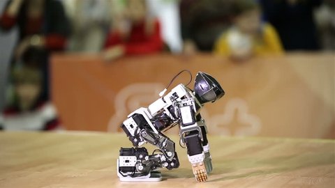 MOSCOW, RUSSIA - FEBRUARY 13, 2015: A little robot dances. National robotic festival.