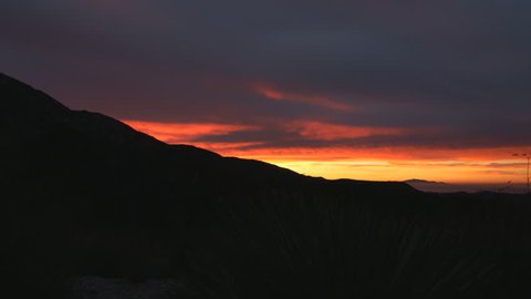 Motion controlled dolly up / pan right time lapse footage with tilt down motion of mountain landscape at dawn in San Gabriel Mountains National Monument, California