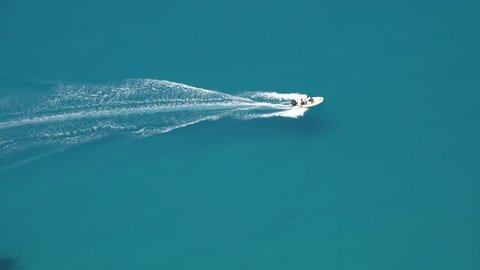 4K Aerial View of Ski Jet Cruise, Sailing, Sea Trip, Tourists Travelling to Tropical Exotic Island Beach, People Enjoying Summer Holiday on Mediterranean Foamy Waves Lefkada Greece Landscape, Seascape