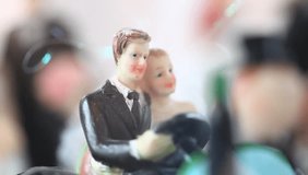 figurine of bride and groom at the wedding table decoration