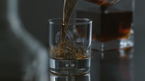 Whisky is poured into glass in slow motion; shot on Phantom Flex 4K at 1000 fps
