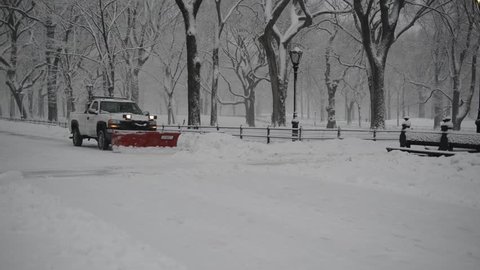 NEW YORK CITY - MARCH 5, 2015. A late season snowfall dumped up to eight inches of snow and has the streets of New York City filled with trucks with plows removing snow all day after the storm.