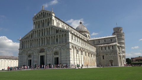 PISA, ITALY - SEPT 2014: Pisa Italy Leaning Tower and Cathedral tourists. Piazza dei Miracoli, Square of Miracles. European medieval art, finest architectural complexes in world. UNESCO Heritage Site.