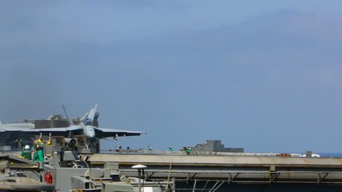 CIRCA 2010s - A fighter jet takes off from an aircraft carrier.
