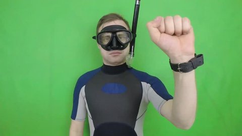 Diving sign- divemaster  shows sing  CAUTION ZONE ,also a available on the green screen all of diving sings from course (open water diver) 1   of 5