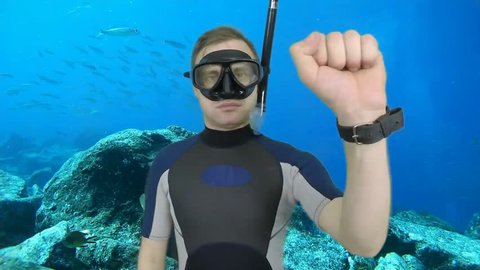 Diving sign- divemaster  shows sing  CAUTION ZONE ,also a available on the green screen all of diving sings from course (open water diver) 2  of 5