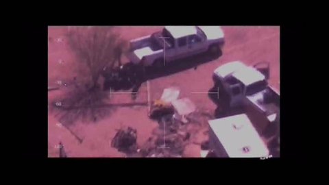 CIRCA 2010s - Surveillance footage taken from a helicopter shows drug cartels moving illegal narcotics along roads in Texas and Mexico.