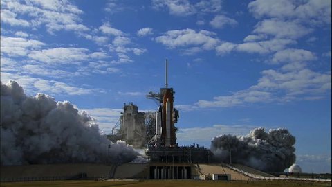 Редакционное стоковое видео: CIRCA 2010s - The Space Shuttle Lifts off from its launchpad.