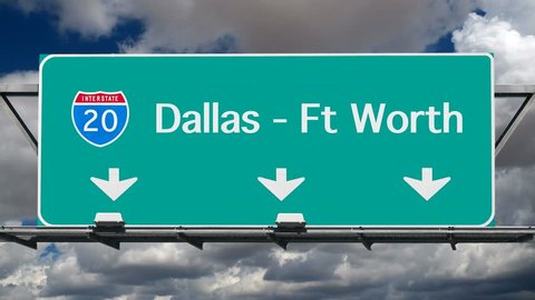 Dallas, Ft Worth Interstate 20 freeway sign with time lapse sky.