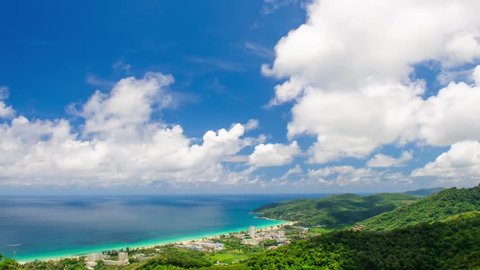 Clouds flying over hilly ocean shore in Phuket, Thailand