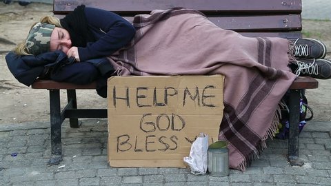 Homeless sick woman begging