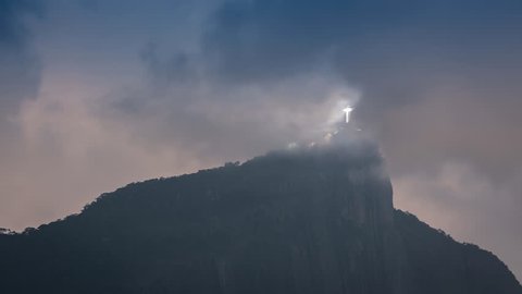 Night Time lapse shot of illuminated Christ with clouds dynamic in Rio de Janeiro,Brazil