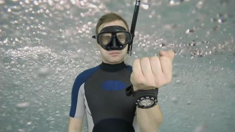 Diving sign- divemaster  shows sing  ASK QUASTIONS  ,also a available on the green screen all of diving sings from course (open water diver) 2  of 11
