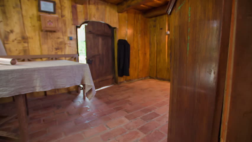 The man comes home . Slow motion RAW footage of a man walking through the door in to the wooden house from Middle Ages. - Powered by Shutterstock - Get 15% off with code: PIKWIZARD15