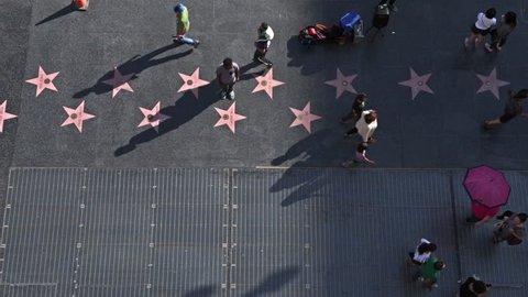 LOS ANGELES - MARCH 8, 2015: People on famous Walk of Fame at Hollywood Blvd. March 8, 2015 in Los Angeles, California. Editorial Stock Video