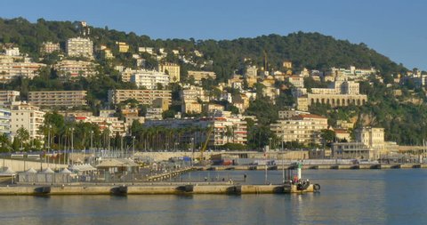 NICE, FRANCE, EUROPE - 4 JAN. French Riviera city port. Cote Dazur harbor with boats. Mediterranean sea travel, tourism. Yachts, ship view on marina water. Coast landscape, cityscape old architecture.