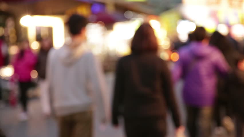 NEW TAIPEI CITY, TAIWAN - MARCH 7, 2015: Defocused Vendors and shoppers at Lehua Night Market in the Yonghe District