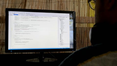 Frontend Developer enters html and dotnet code on his project, 4k