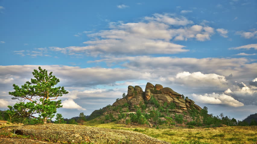 Sunset timelapse with rock and tree