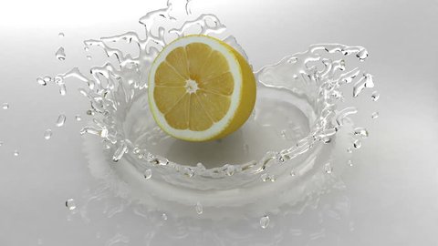 Lemon falls into water with a splash Stockvideó