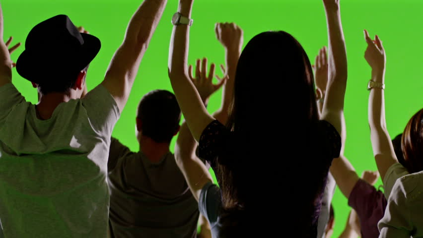 Crowd of fans dancing on green screen. Concert, Jumping, Dancing, Hands up. Slow motion. Shot on RED EPIC Cinema Camera.