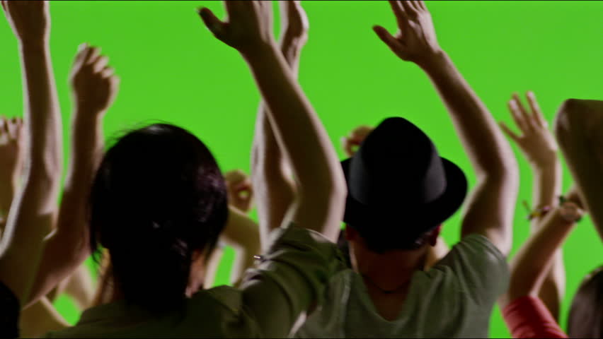 Crowd of fans dancing on green screen. Concert, Jumping, Dancing, Hands up. Slow motion. Shot on RED EPIC Cinema Camera.