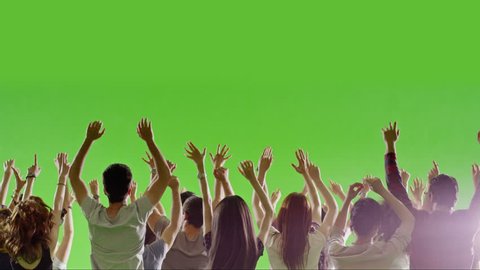 Crowd of fans dancing on green screen. Concert, Jumping, Dancing, Hands up. Slow motion. Shot on RED EPIC Cinema Camera.
