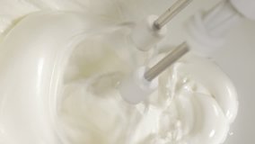 Hand mixing egg whites with mixer close-up 4K 2160p UHD footage - Mixing egg whites with electric mixer 4K 3840X2160 UHD video